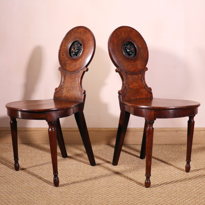 Pair Of Oak Lion Hall Chairs (2)